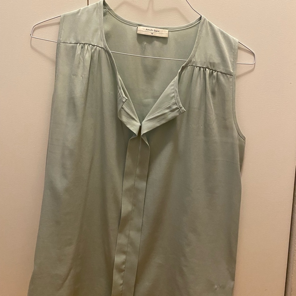 Light green sleeveless blouse